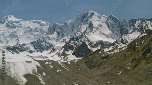 Glorious alpine panorama, snowy white Belukha Mount towering above Akkem glacier