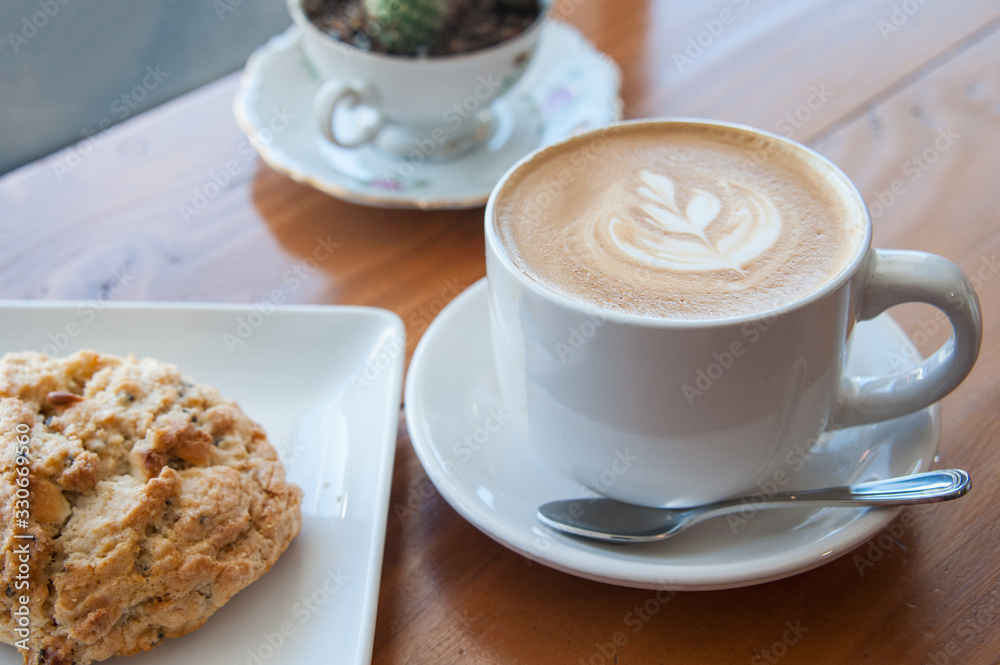 Cafe Latte on the table at bright setting, cafe time, breakfast Cafe Latte on the table at bright setting, cafe time, breakfast