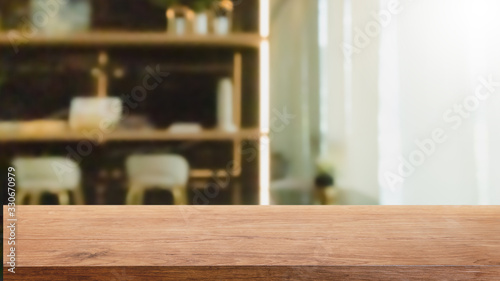 Empty wood table top and blurred home interior with window room background. - can used for display or montage your products.