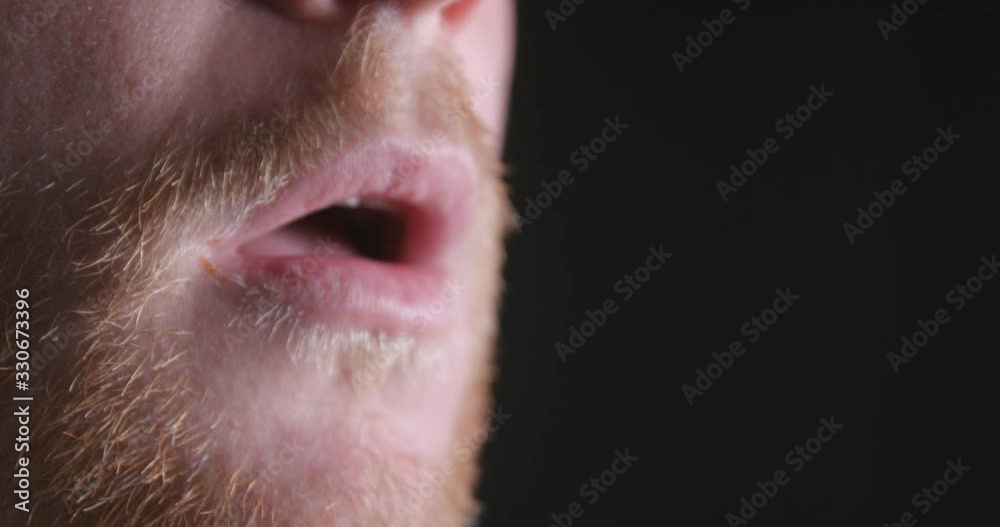 Breathing man mouth close-up slow motion, studio shot in 4K prores HQ Breathing man mouth close-up slow motion, studio shot in 4K prores HQ