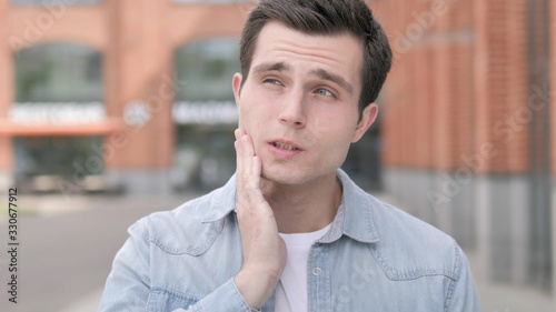 Toothache, Outdoor Portrait of Young Man with Tooth Pain