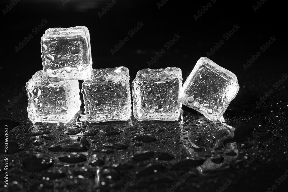 ice cubes on black table background. ice cubes on black table background.
