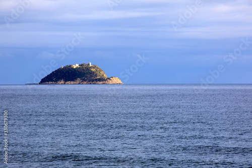 Alassio  SV   Italy - December 12  2017  Gallinara island view from Alassio  Riviera dei Fiori  Savona  Liguria  Italy.