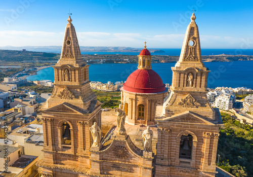 Aerial view close up view of Mellieha Parish Church or Birth of Our Lady. Sea and blue sky. Malta country