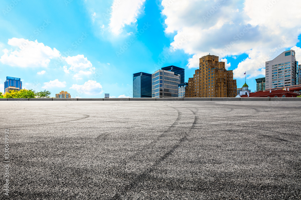 Shanghai empty asphalt road and beautiful urban architecture landscape in summer Shanghai empty asphalt road and beautiful urban architecture landscape in summer