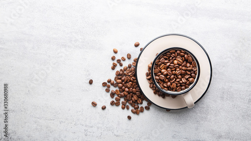 Cup filled with roasted coffee beans