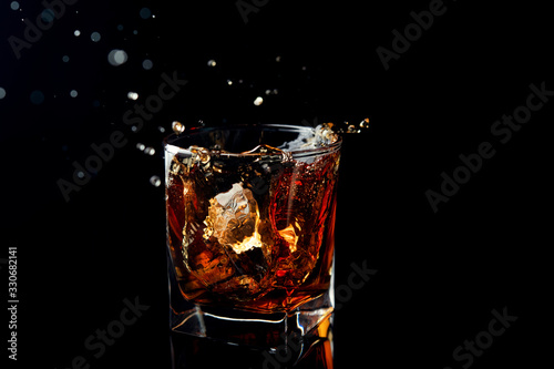 Whiskey splash in glass