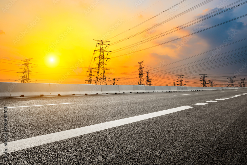 Asia empty asphalt road and power tower nature landscape at summer sunset Asia empty asphalt road and power tower nature landscape at summer sunset