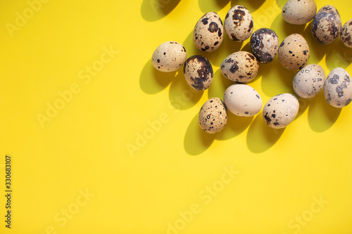 easter background with quail eggs on yellow background. Text spase	