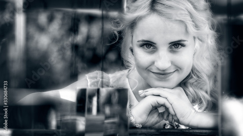 Obraz na plátně retro style portrait of a young, blonde woman through the installation of mirror
