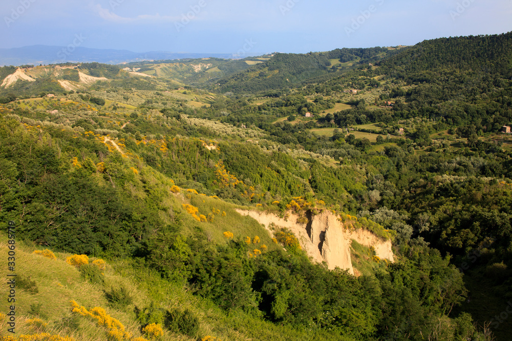Civita di Bagnoregio (VT), Italy - May 15, 2016: Soft eroded clay landscape around Civita di Bagnoregio, Tuscia, Lazio, Italy
