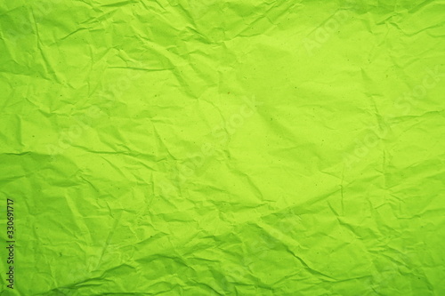 Green crumpled paper empty background