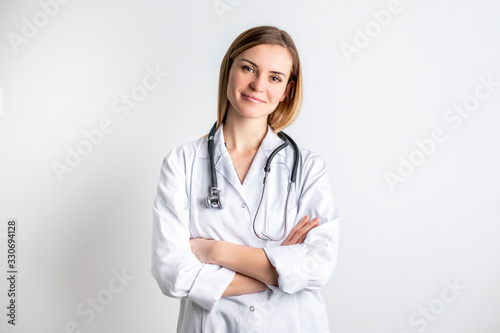 Medical concept of young female doctor in white coat with stethoscope