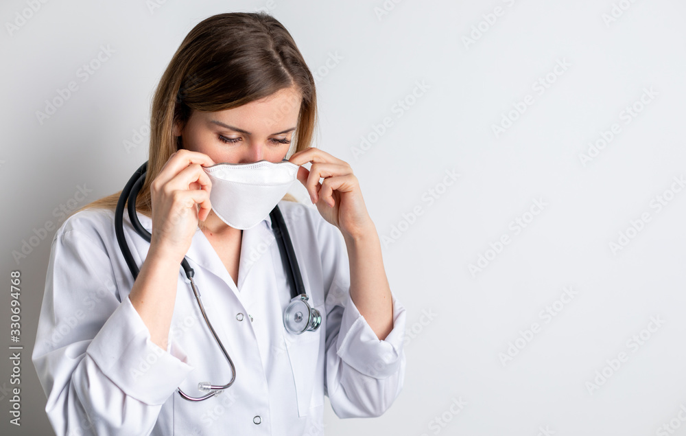 Virus mask female doctor puts on face protection in prevention for coronavirus Virus mask female doctor puts on face protection in prevention for coronavirus