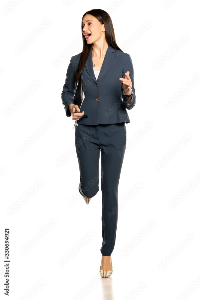 Excited beautiful business woman running and shouting Excited beautiful business woman running and shouting