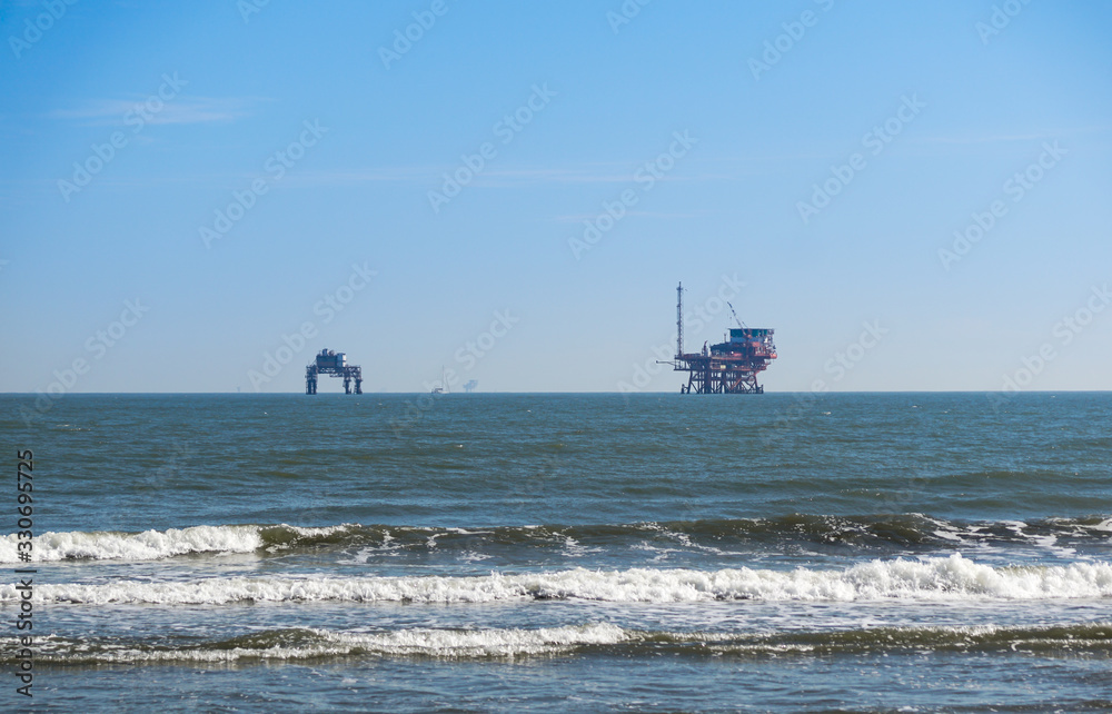 platform in the Sea . oil platform from the beach platform in the Sea . oil platform from the beach