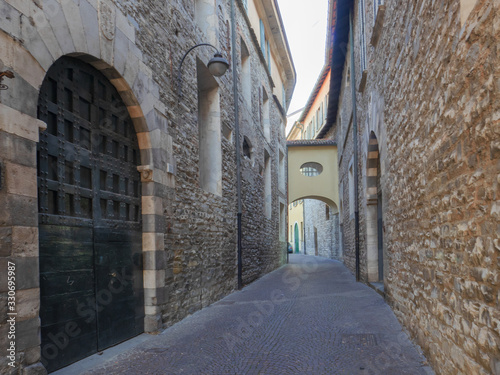 Fototapeta Naklejka Na Ścianę i Meble -    ncient medieval alley with stone buildings in the historic center of a small village in Lombardy
