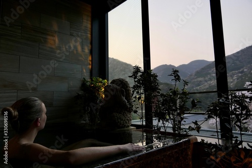 Blond woman in traditional Japanese Onsen, Hakone, Japan