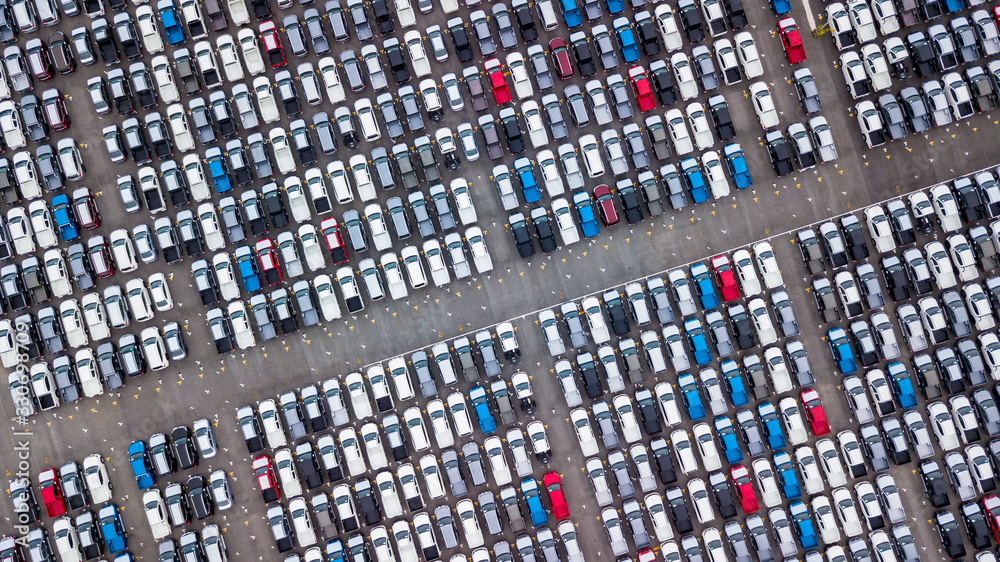 Obraz premium Aerial view new cars parking for sale stock lot row, New cars dealer inventory import export business commercial global, Automobile and automotive industry distribution logistic transport worldwide.