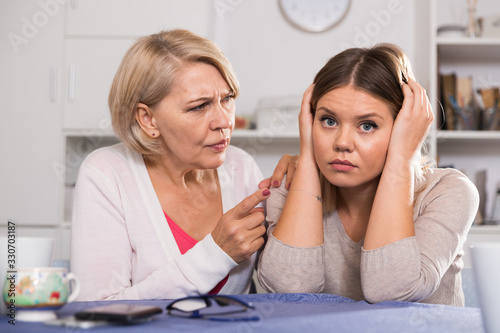 Mother scolds her adult daughter