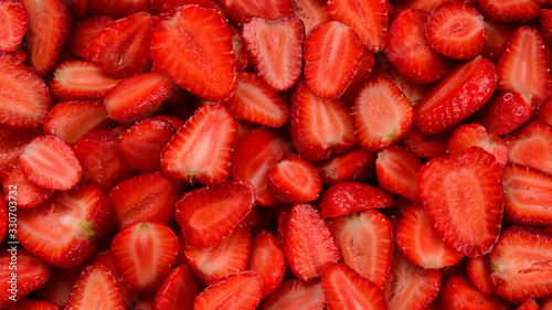 Strawberry slices. Fresh berries macro. Fruit background. Top view.