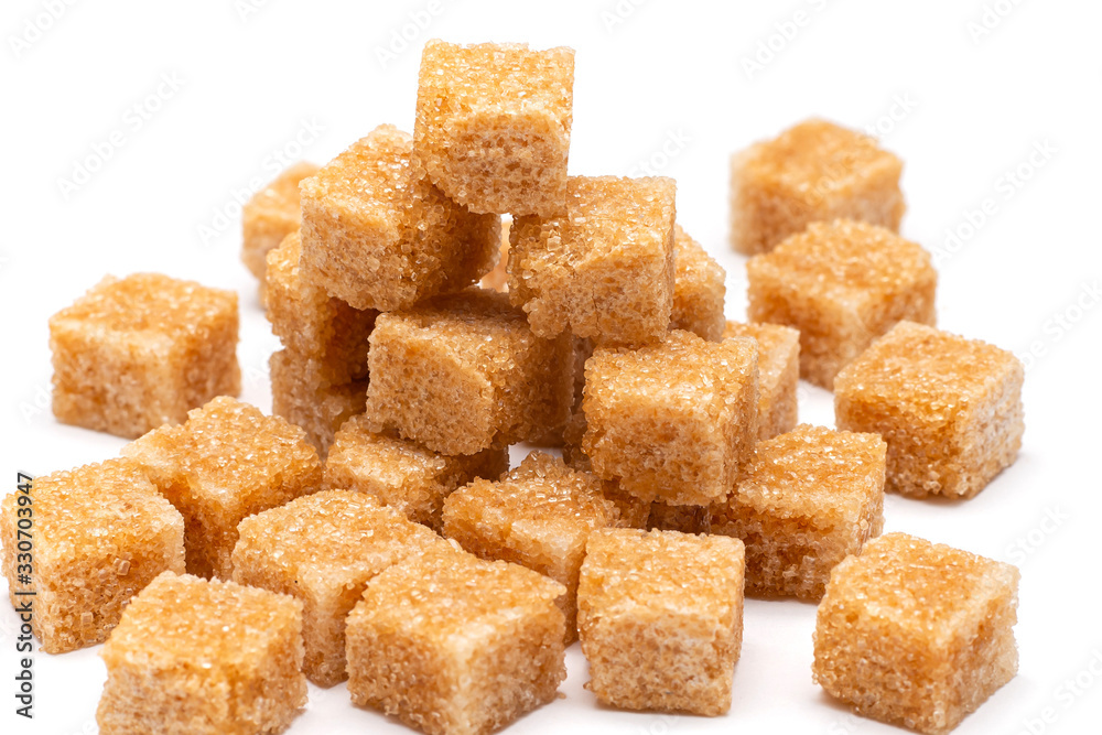 brown refined sugar on a white background brown refined sugar on a white background