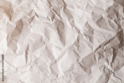 Crumpled white paper background.
