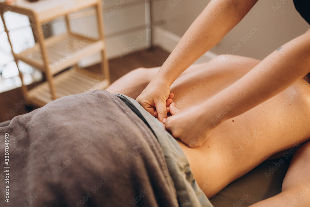 Fototapeta premium Massage in wellness spa salon. Health care, relaxation, hand massage concept