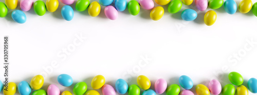 Canvas Print Colorful easter eggs border on white background with a large copy space