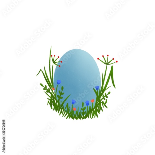 Photos Easter blue egg hidden in the grass and flowers