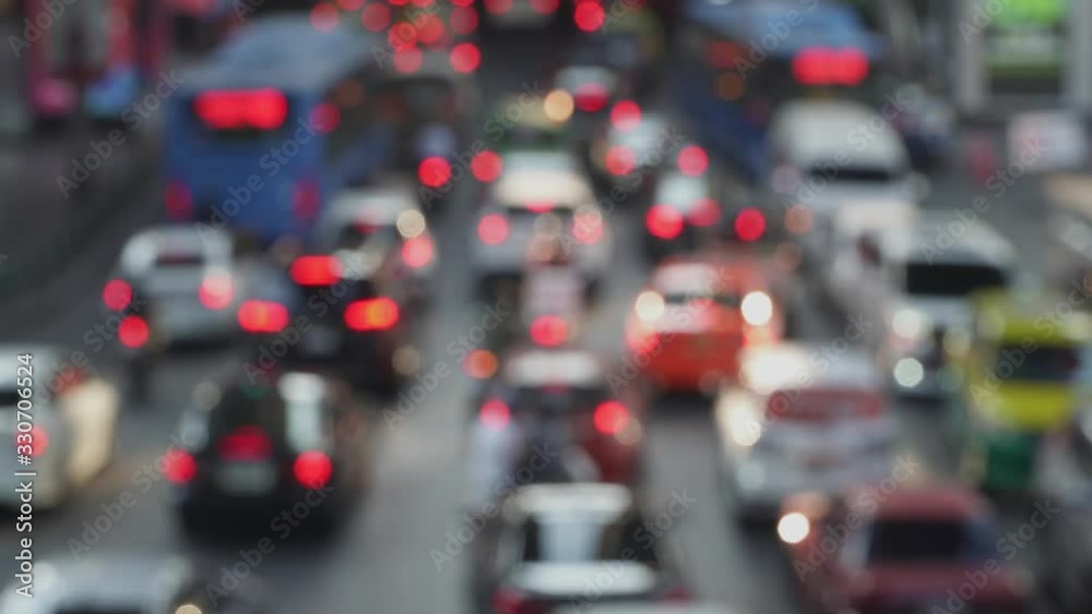 4K video bokeh of car lights stuck in traffic jam during rush hour of the commute to work  in the busy and polluted city of Bangkok capital of Thailand
