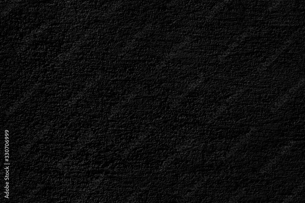 Abstract black background. Black stucco texture. Dark rough surface.