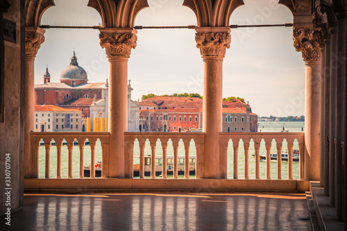 First floor arcade and balcony of the Doge Palace or Palazzo Ducale with a view on the lagoon in Venice Italy photo