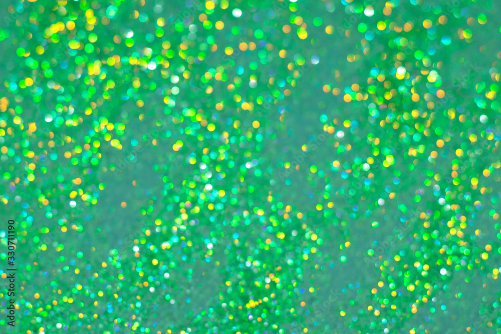 Thousand bokeh blur green sparkles. Perfect St.Patrick's Day background for your design.