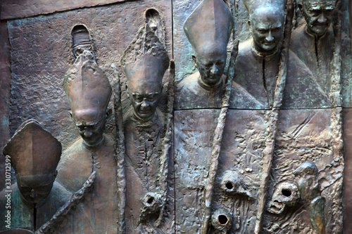 Lubiana / Slovenia - December 8, 2017: Particular of the sculpure on Saint Nicholas churc door in Lubiana, Slovenia photo