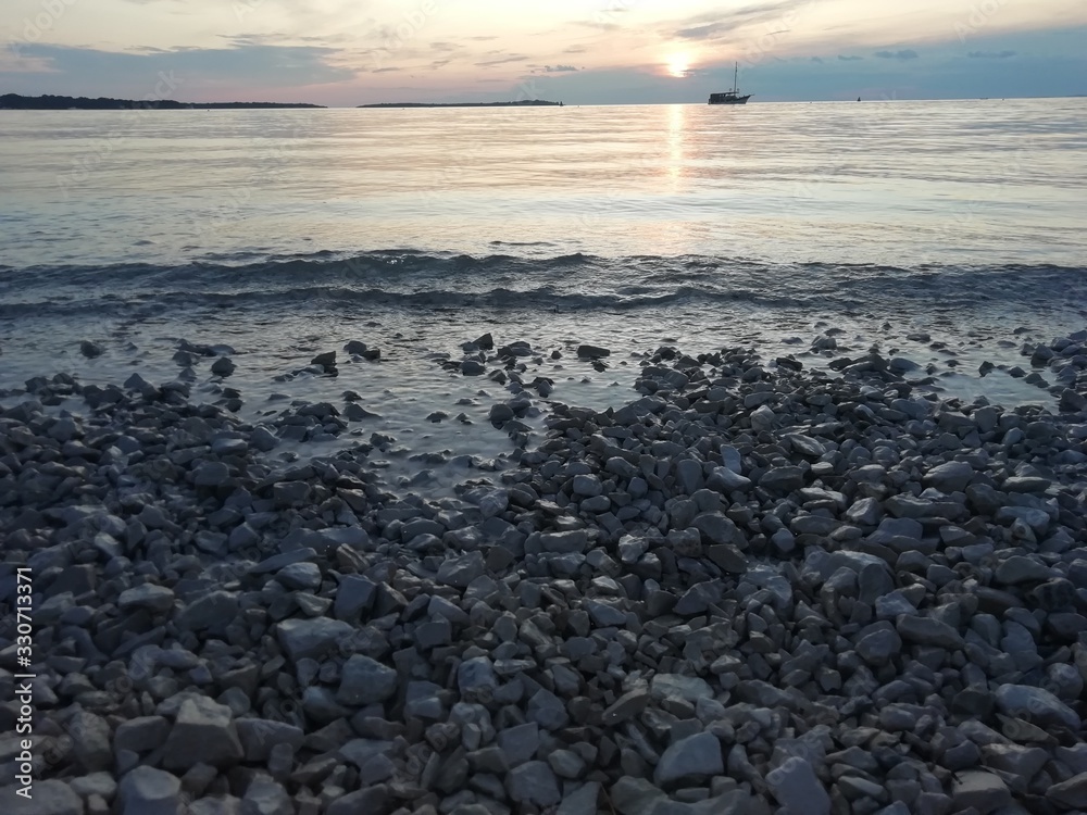 Romantic sunset on the beach in Fazana in Croatia in 2019.