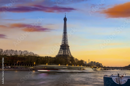 Eiffel tower and Seine river in the sunset sky scene.