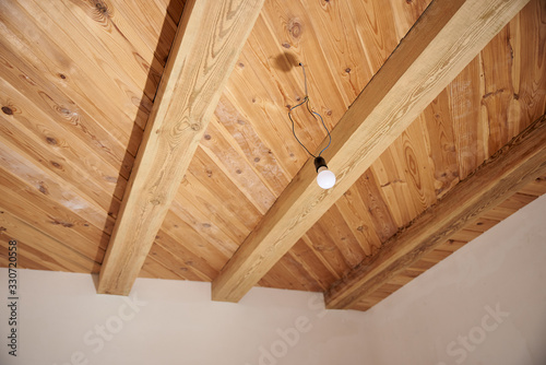 Repair in the apartment / house. Wooden ceiling on wood beams.