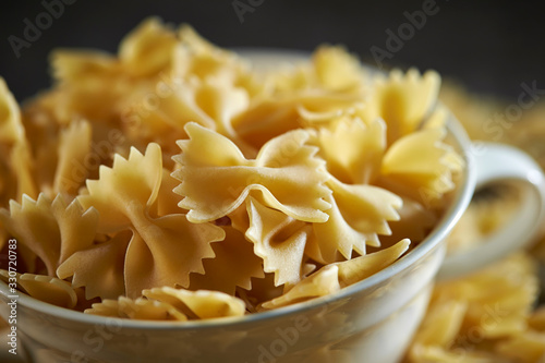 Dried farfalle pasta in cup