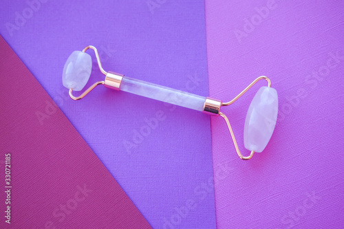 Roller face massager made of quartz.