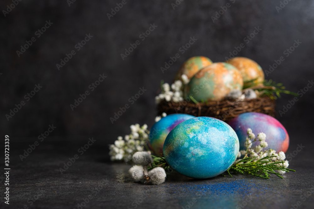 Easter colored eggs with spring flowers Easter colored eggs with spring flowers