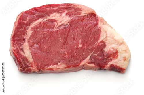 raw rib eye steak isolated on white background photo