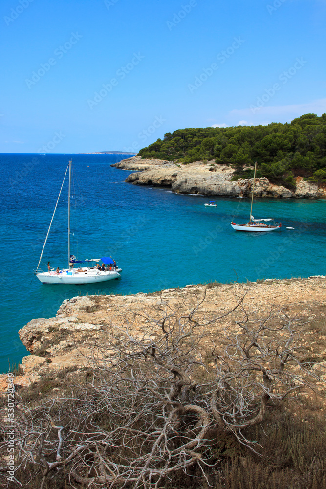 Obraz premium Es Migjorn Gran, Menorca / Spain - June 25, 2016: The Escorxada bay, Es Migjorn Gran, Menorca, Balearic Islands, Spain