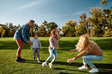 Where children grow in mind and spirit. Excited family having fun outdoors on a sunny day