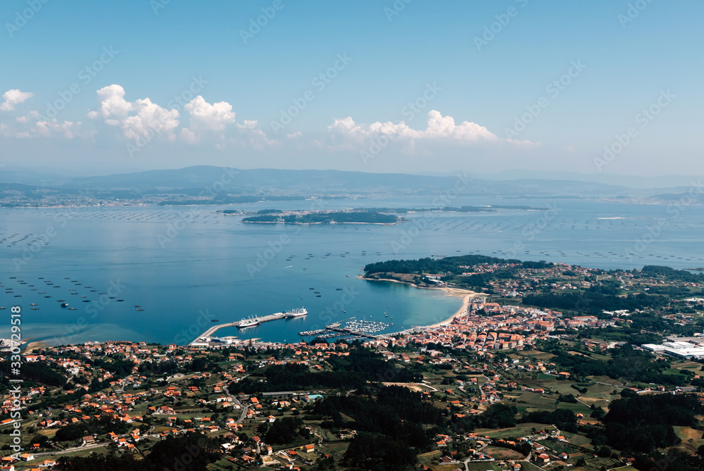 Aerial view of city with beach in Galicia, northern Spain