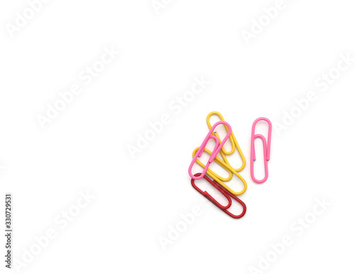 Colored paper clips on white background