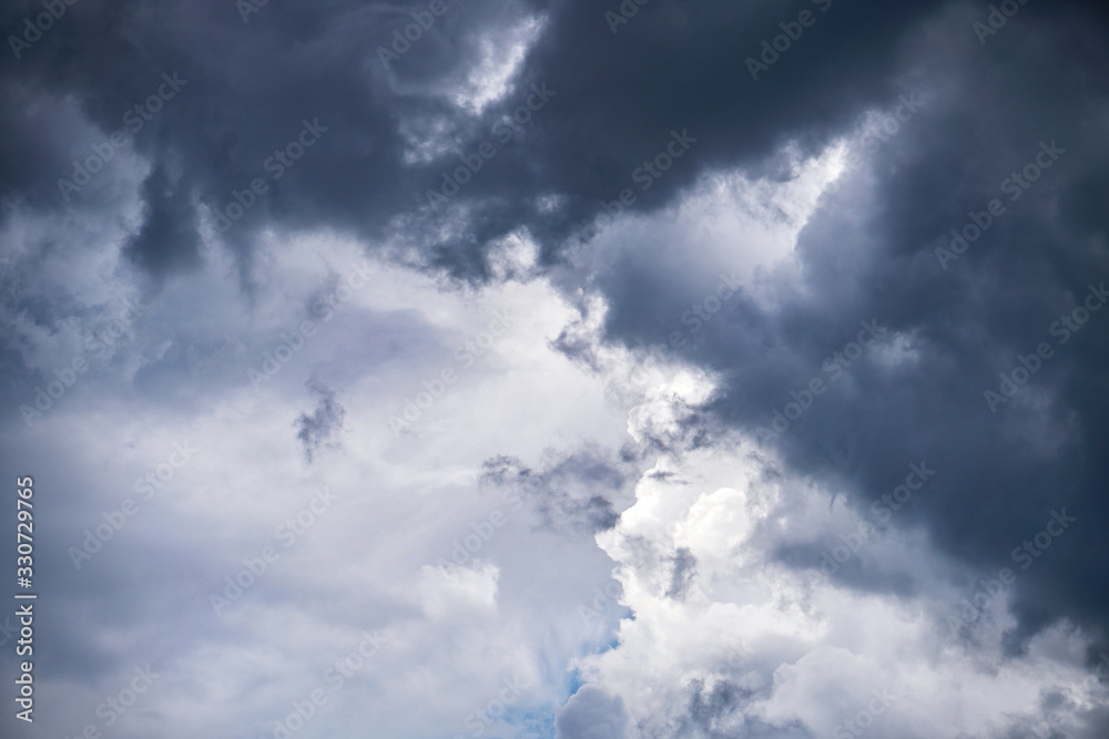 Terrible thunderclouds from the side of a plane. Gloomy epic clouds. Background image in a dark gray style. Terrible thunderclouds from the side of a plane. Gloomy epic clouds. Background image in a dark gray style.