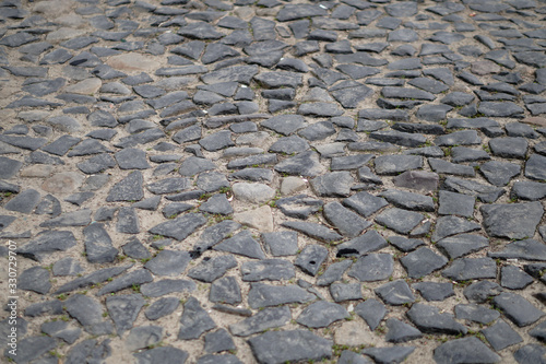 Old paving stones on the streets of europe. Stock photo for design