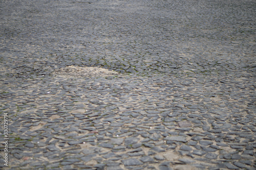 Old paving stones on the streets of europe. Stock photo for design