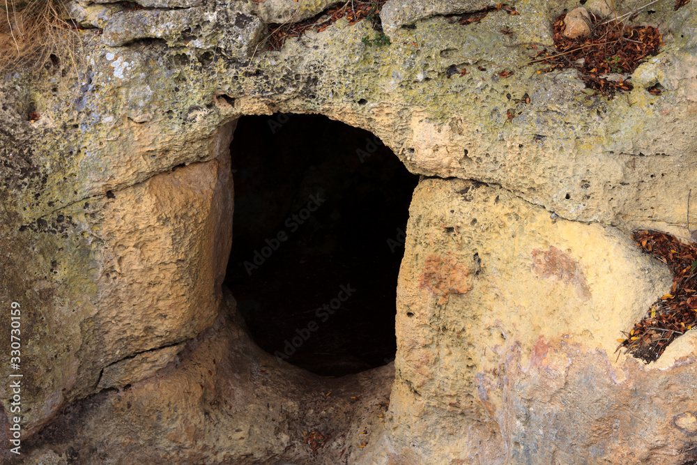 Salort site, Menorca / Spain - June 23, 2016: A gate to prehistoric cave at Taula de Torralba d'en Salort, Menorca, Balearic Islands, Spain